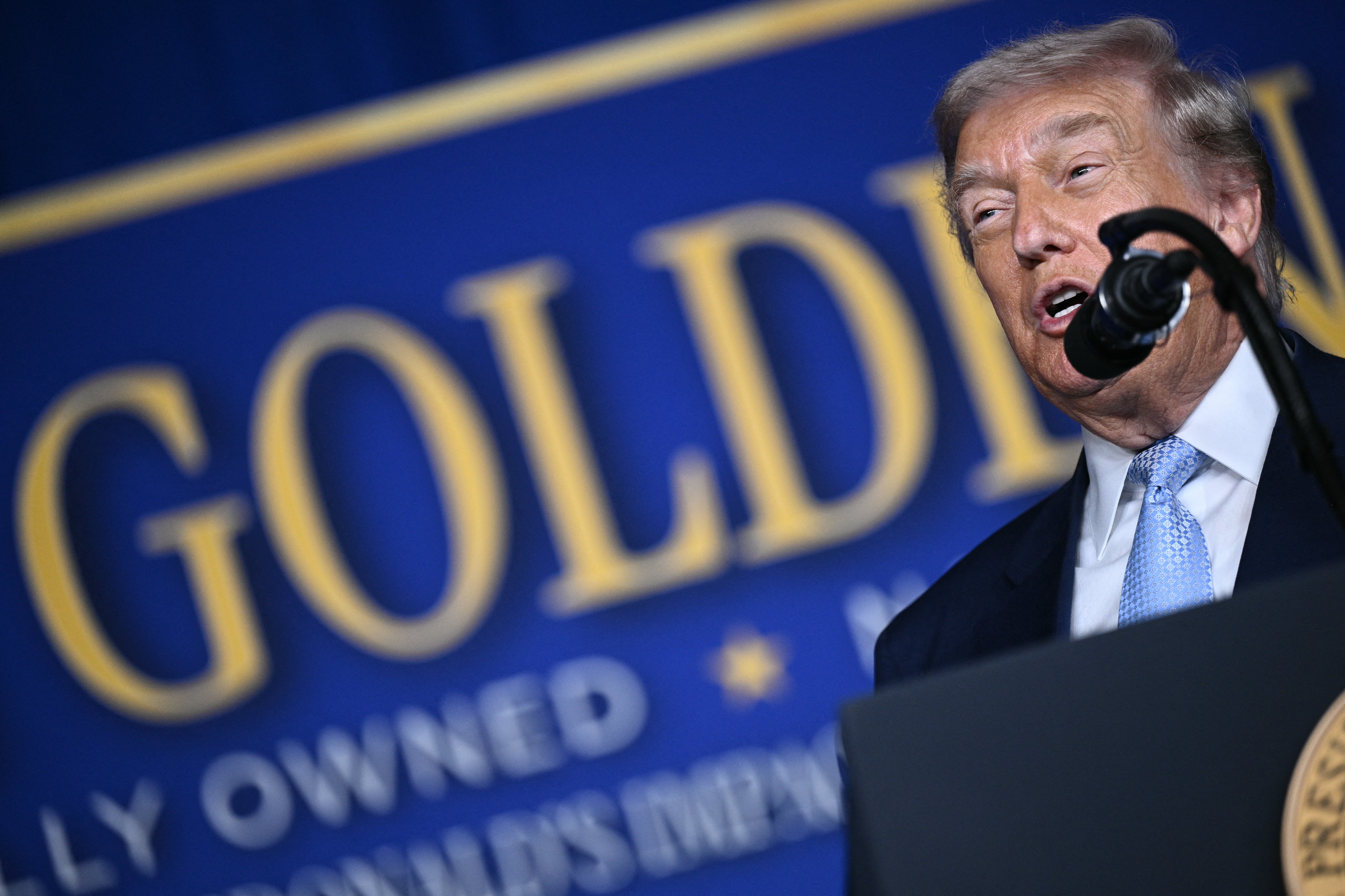 US President Donald Trump delivers remarks at McDonald's Impact Summit in Washington, DC on November 17, 2025. (Photo by Brendan SMIALOWSKI / AFP)